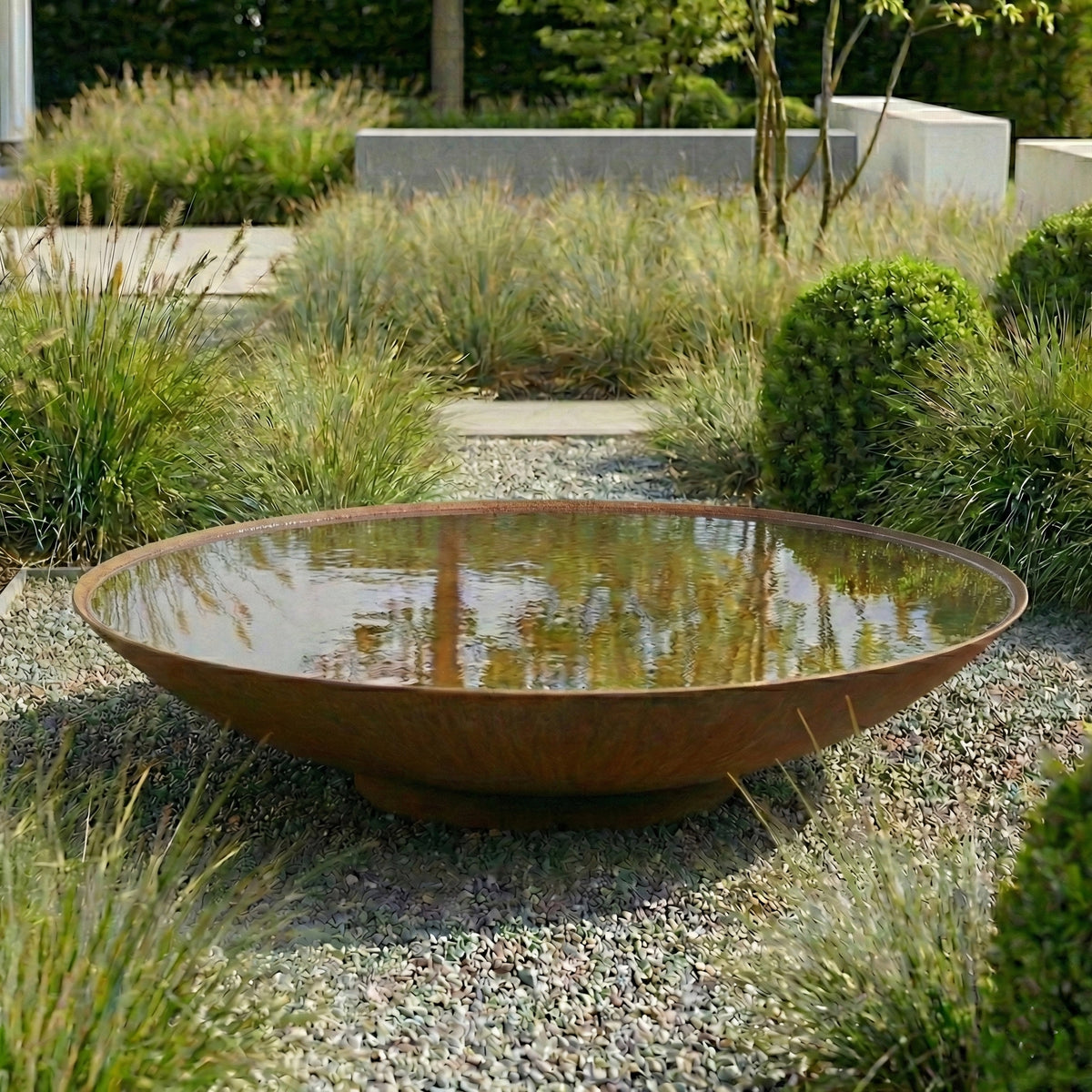 Corten Steel Water Bowl in a Garden